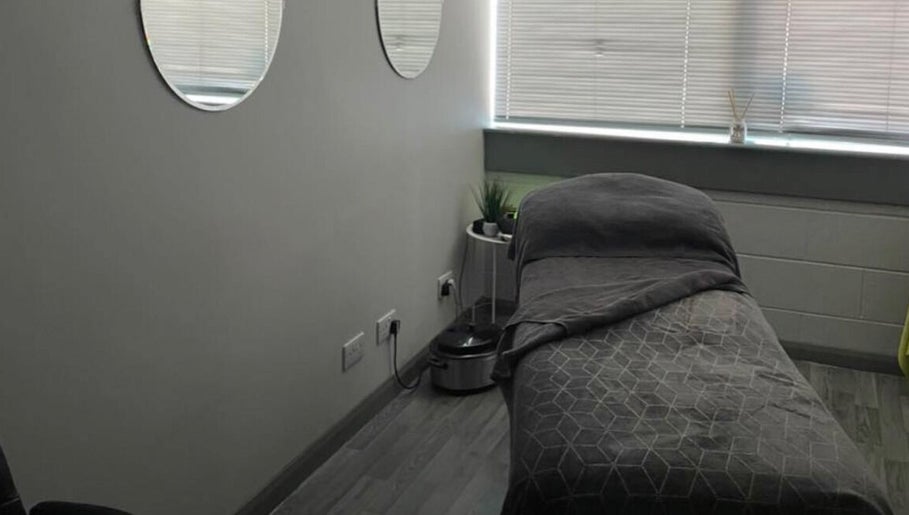 Tranquil massage room at R and R Tranquility, Aberdeen, Scotland, GB. Cozy ambiance with soft lighting.