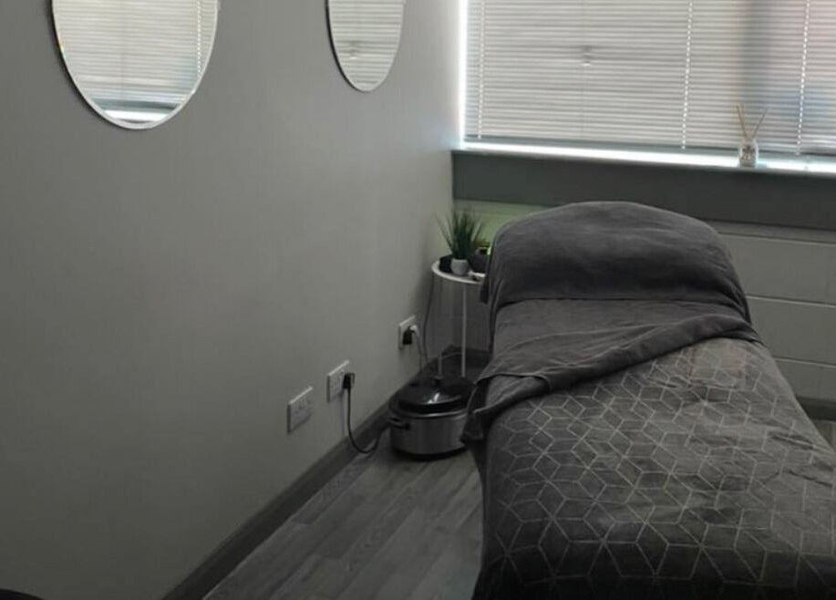 Tranquil massage room at R and R Tranquility, Aberdeen, Scotland, GB. Cozy ambiance with soft lighting.