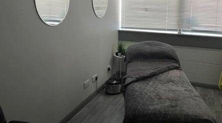 Tranquil massage room at R and R Tranquility, Aberdeen, Scotland, GB. Cozy ambiance with soft lighting.