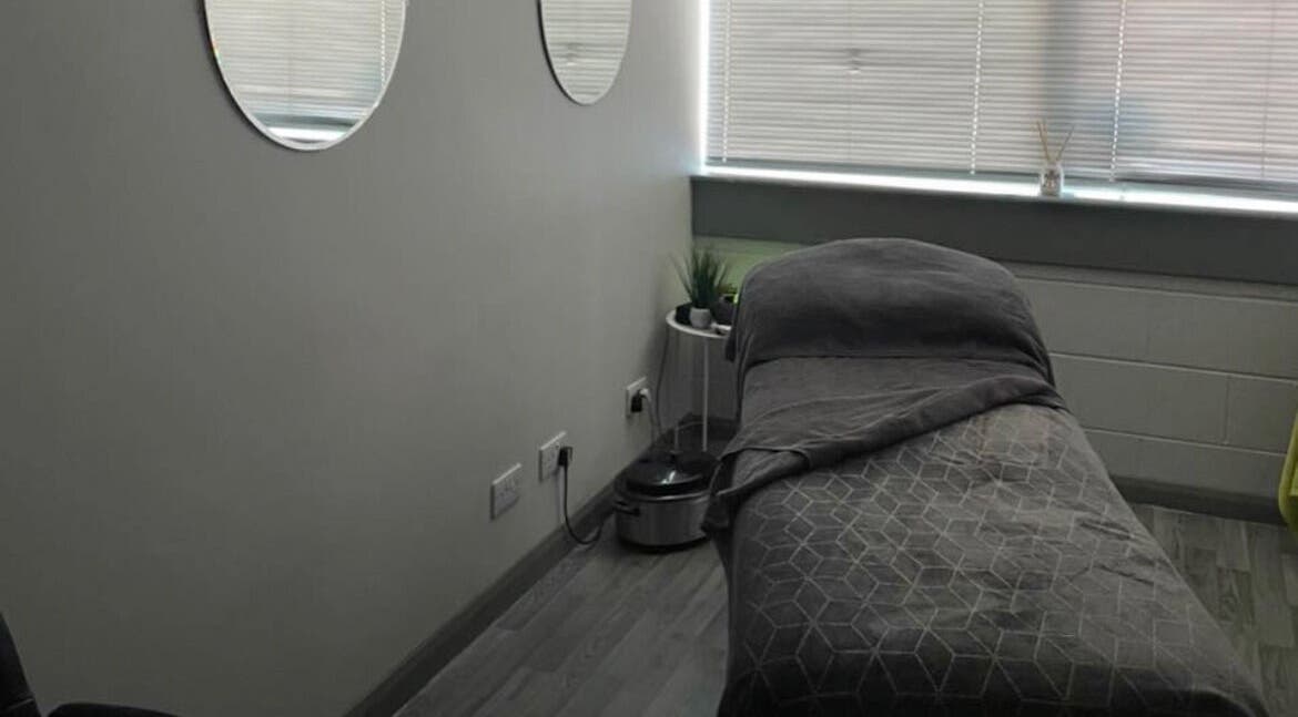 Tranquil massage room at R and R Tranquility, Aberdeen, Scotland, GB. Cozy ambiance with soft lighting.