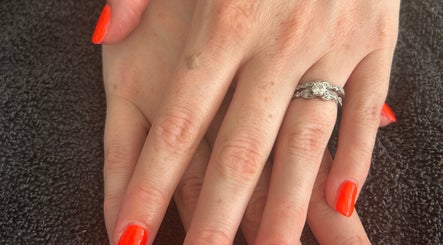 Elegant hands with vibrant nails at R and R Tranquility, Aberdeen, Scotland, GB.