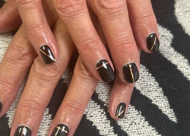Stylish black and gold nail art at R and R Tranquility, Aberdeen, Scotland, GB.
