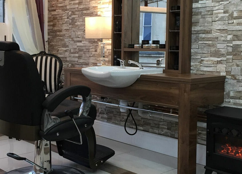 Elegant barber chair and sink at Berkeley Barbers, Bristol, England, GB.