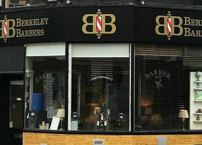 Chic exterior view of Berkeley Barbers at Bristol, England, GB showcasing modern design.