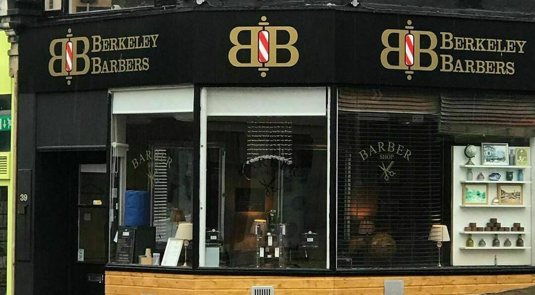 Chic exterior view of Berkeley Barbers at Bristol, England, GB showcasing modern design.