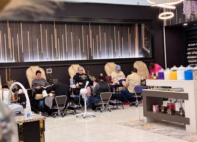 Guests enjoy pedicures in luxury chairs at NL Nail Lounge and Bar, Corydon, Indiana, US.