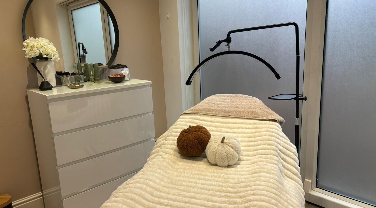 Serene treatment room at House of Glam Wickersley, Bramley, England, GB showcasing cozy ambiance and decor.