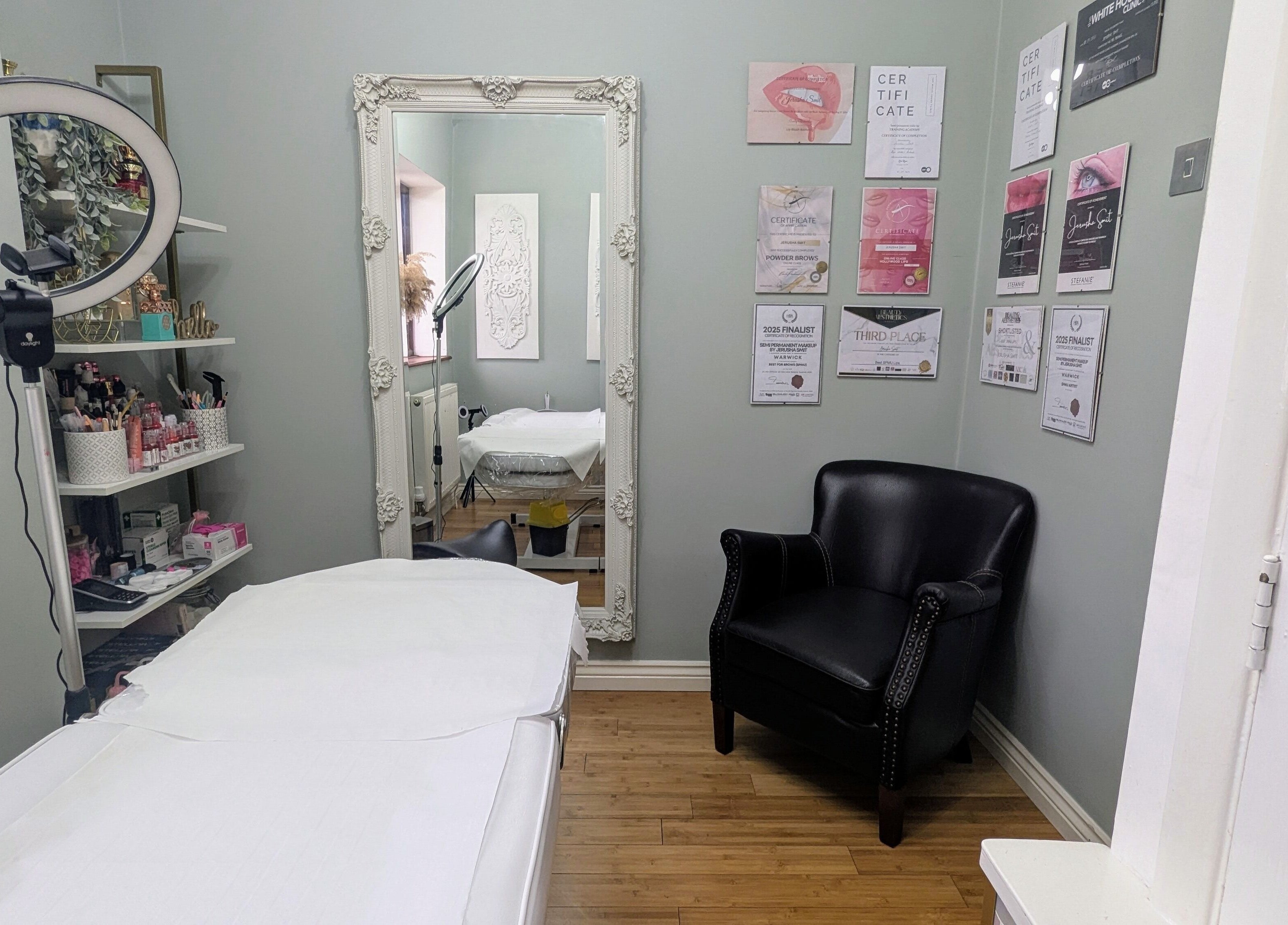 Treatment room at Semi Permanent Makeup by Jerusha Smit, Warwick, England, GB with chair, mirror, and decor.