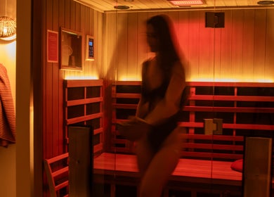 Relaxing sauna experience at Studio Sweat, Auckland, Auckland, NZ with warm lighting and wooden interiors.