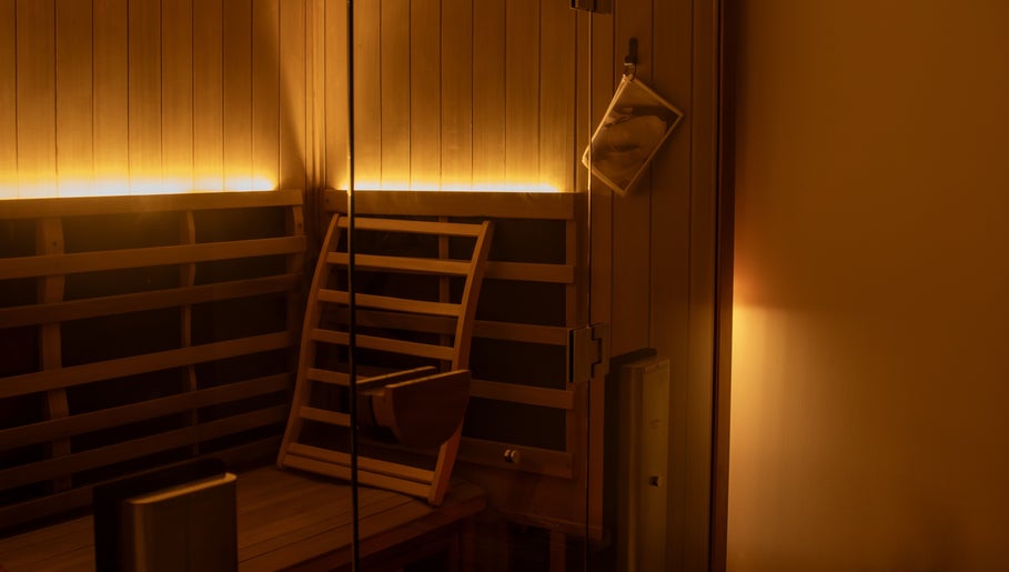 Cozy sauna room with warm lighting at Studio Sweat, Auckland, Auckland, NZ.