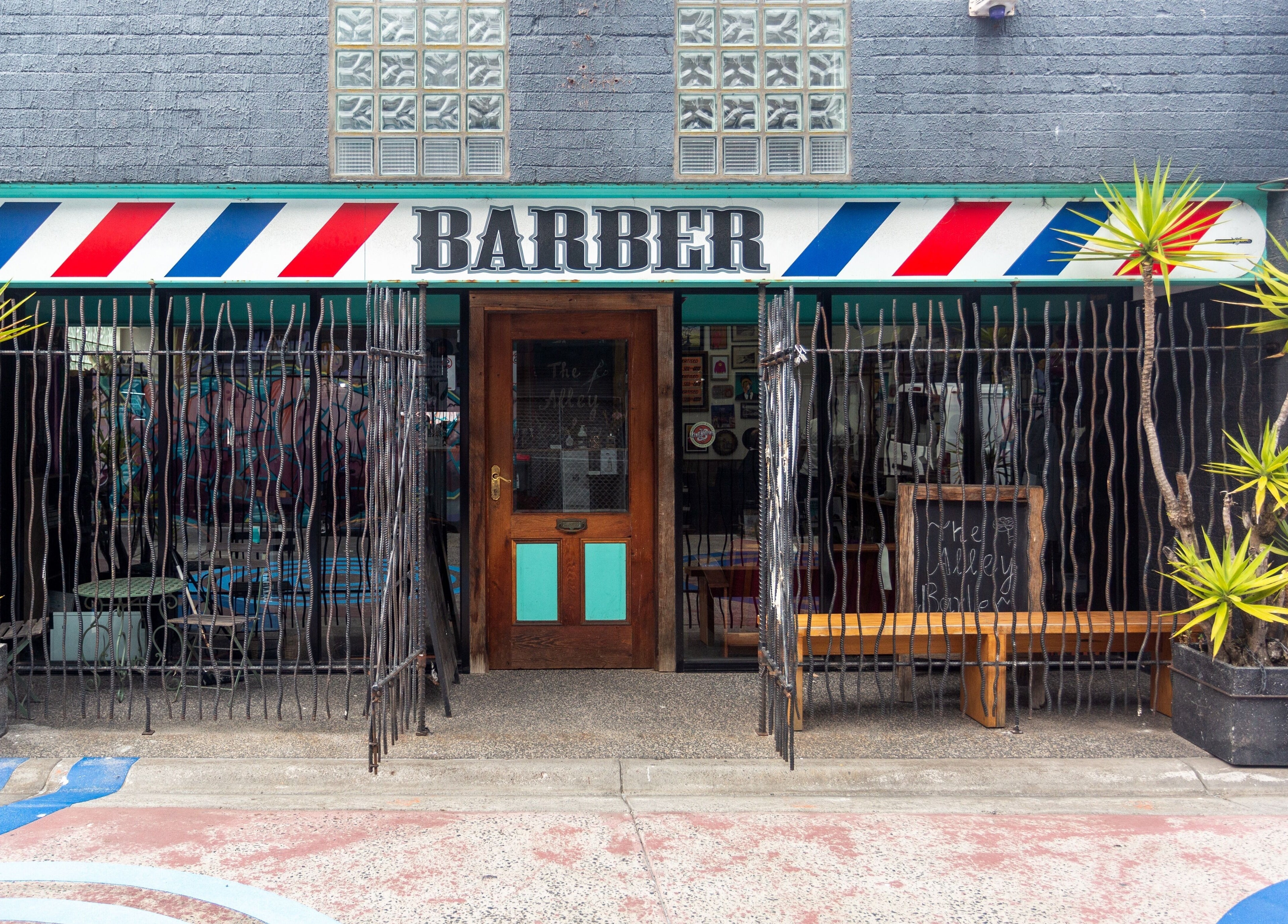 Front view of The Alley Barber Frankston with vibrant signage at Frankston, VIC, AU.