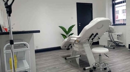 Treatment room at Solace Health and Beauty, Weston-super-mare, England, GB. Features a reclining chair and serene decor.