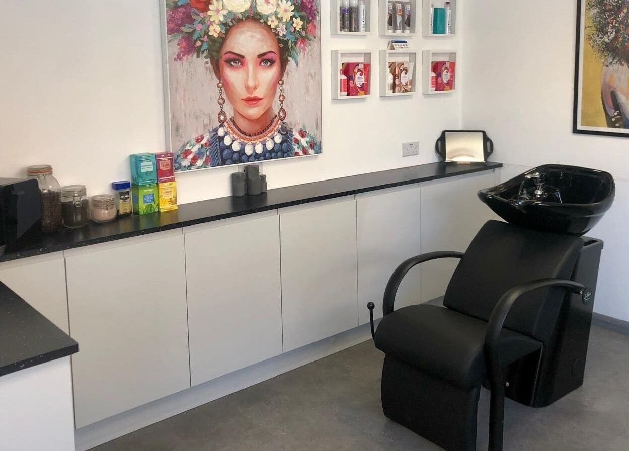 Elegant salon wash station at The Style Pod, Crawley, England, GB, highlighting modern decor and colorful art.
