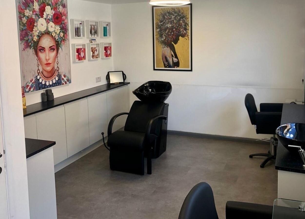 Modern hair salon interior at The Style Pod, Crawley, England, GB showcasing stylish decor and washbasin.