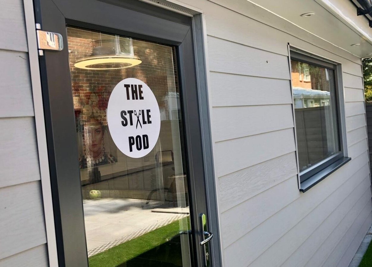 Entrance of The Style Pod in Crawley, England, GB with stylish logo on the glass door.