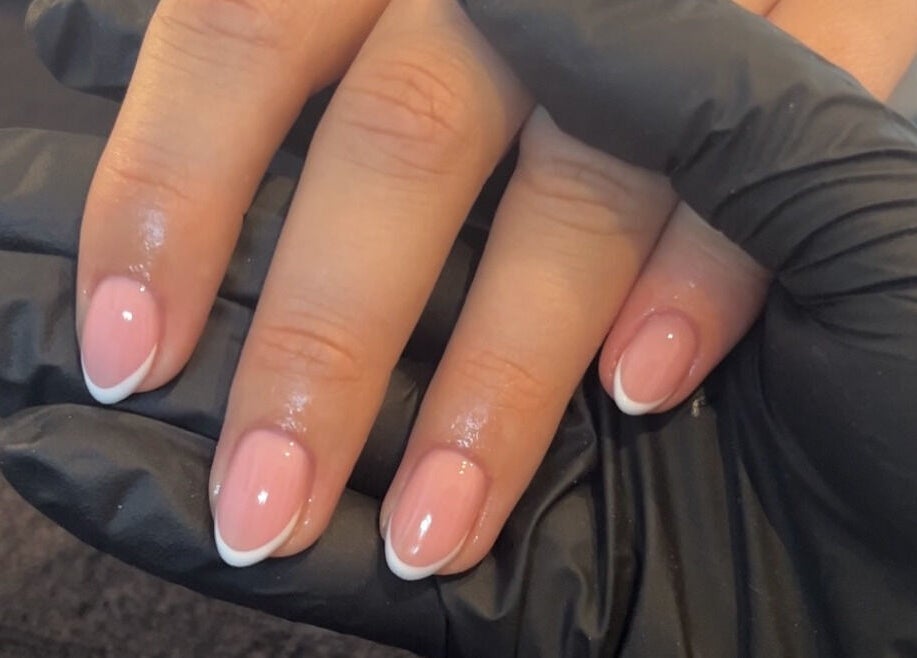 Glossy French manicure at TBM Studio in Bolton, England, GB showcasing skilled nail artistry.
