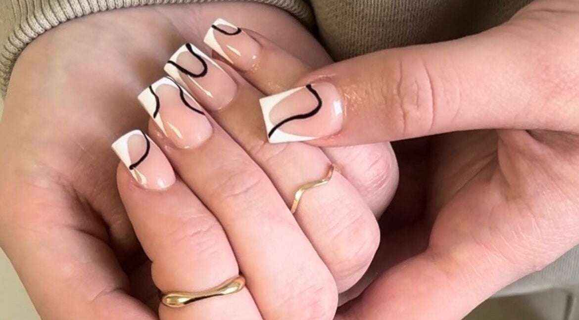 Stylish black and white nail art at TBM Studio, Bolton, England, GB. Perfectly manicured hands.