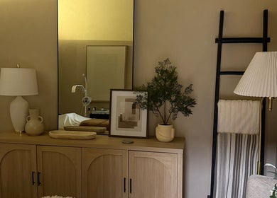 Elegant decor in a calming room at Gloss Spa, Lenexa, Kansas, US, featuring soft lighting and minimalist design.