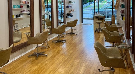 Chic salon interior at Stratten & Co, Burraneer, New South Wales, AU with sleek styling chairs and mirrors.