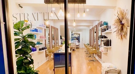 Interior of Stratten & Co salon in Burraneer, New South Wales, AU with elegant decor and beauty products.