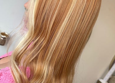 Sleek blonde hair styled at Hair by Harriet, Nuneaton, England, GB, showcasing smooth texture.