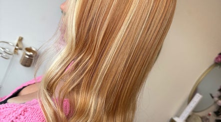 Sleek blonde hair styled at Hair by Harriet, Nuneaton, England, GB, showcasing smooth texture.