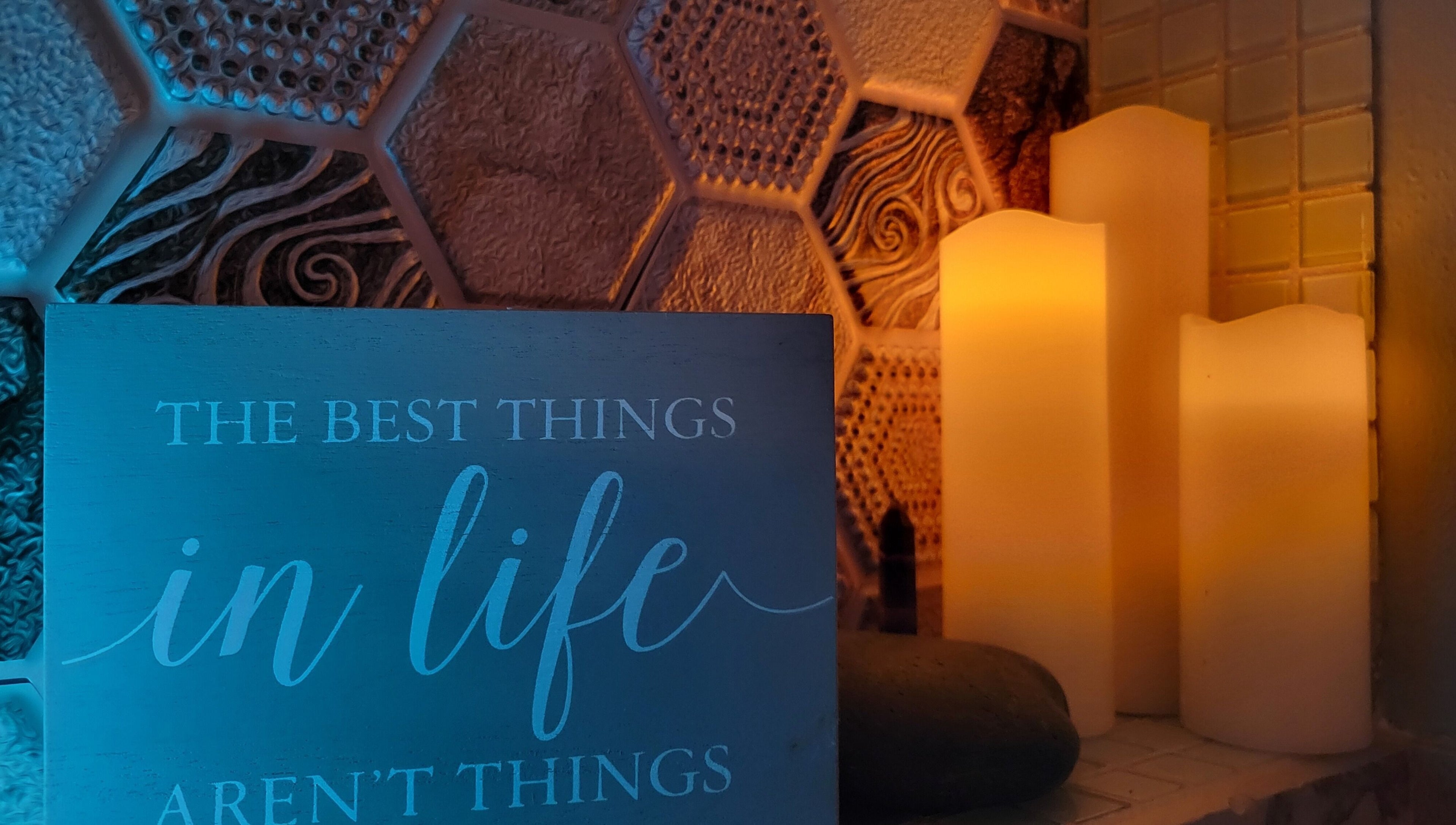 Candles and motivational sign at The Compass Spa Therapy & Wellbeing in Tampa, Florida, US radiate serenity.