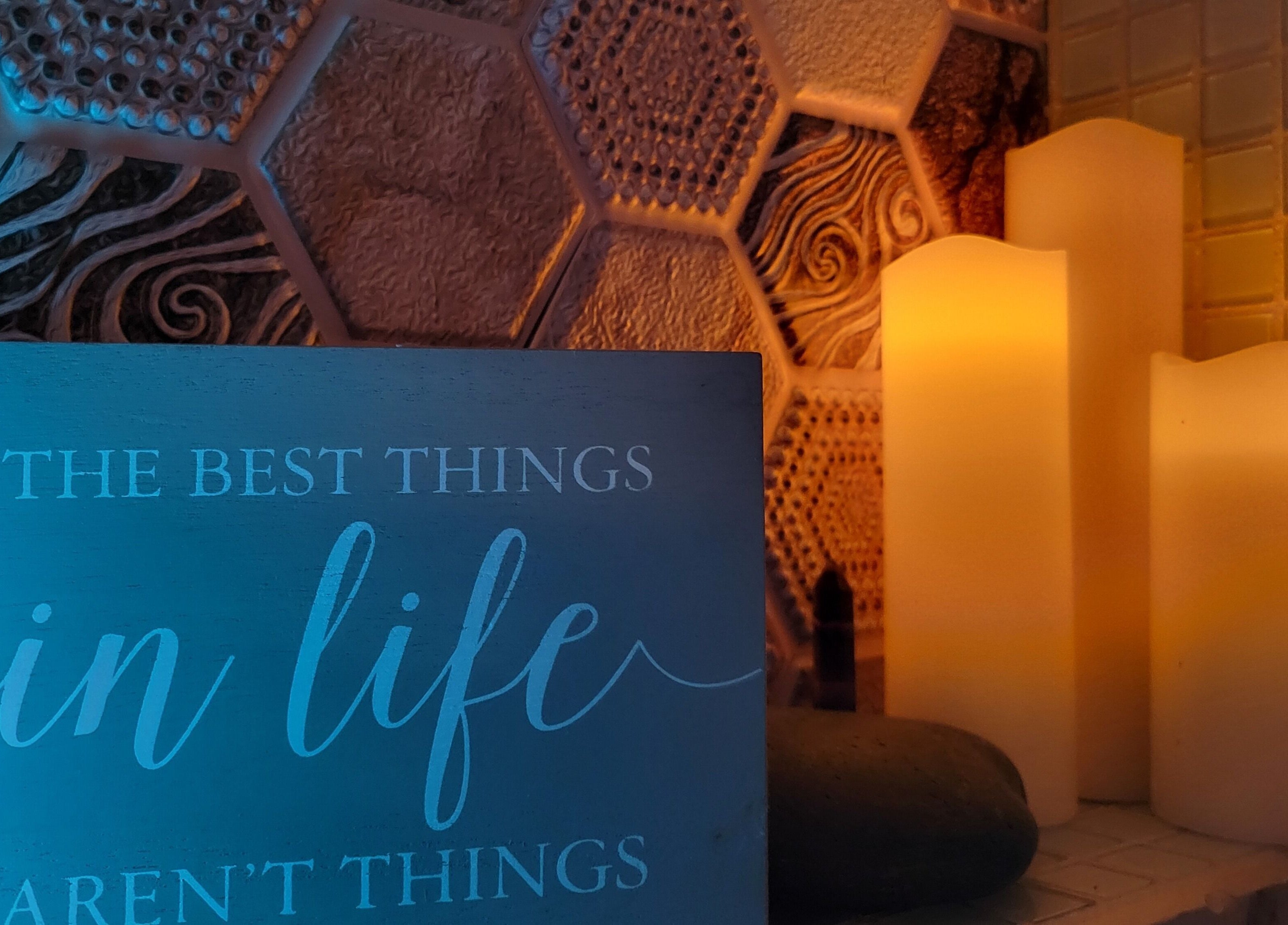 Candles and motivational sign at The Compass Spa Therapy & Wellbeing in Tampa, Florida, US radiate serenity.