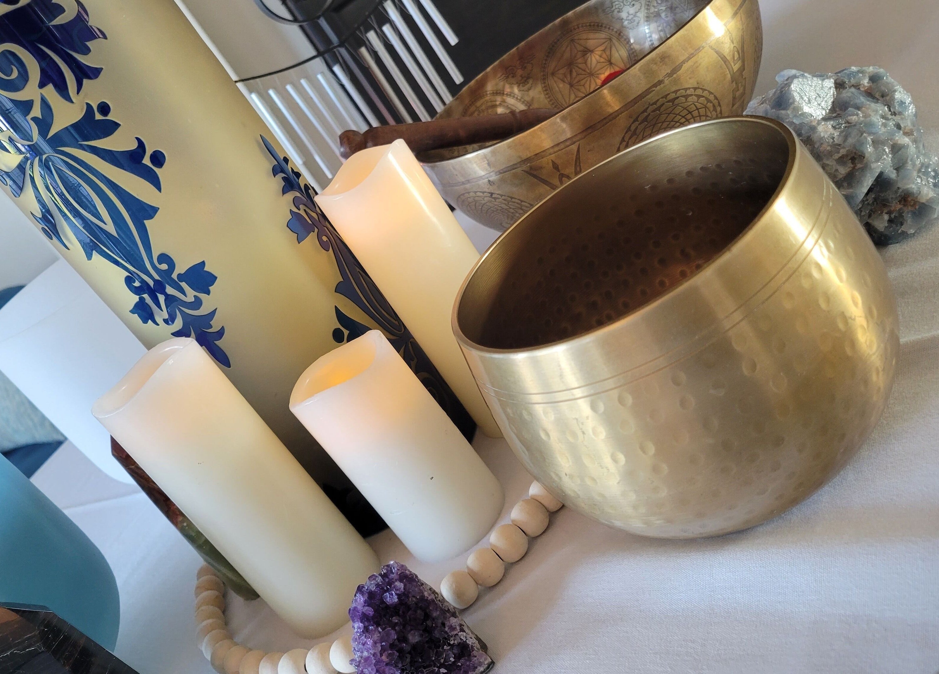 Tranquil setup with candles and bowls at The Compass Spa Therapy & Wellbeing, Tampa, Florida, US.