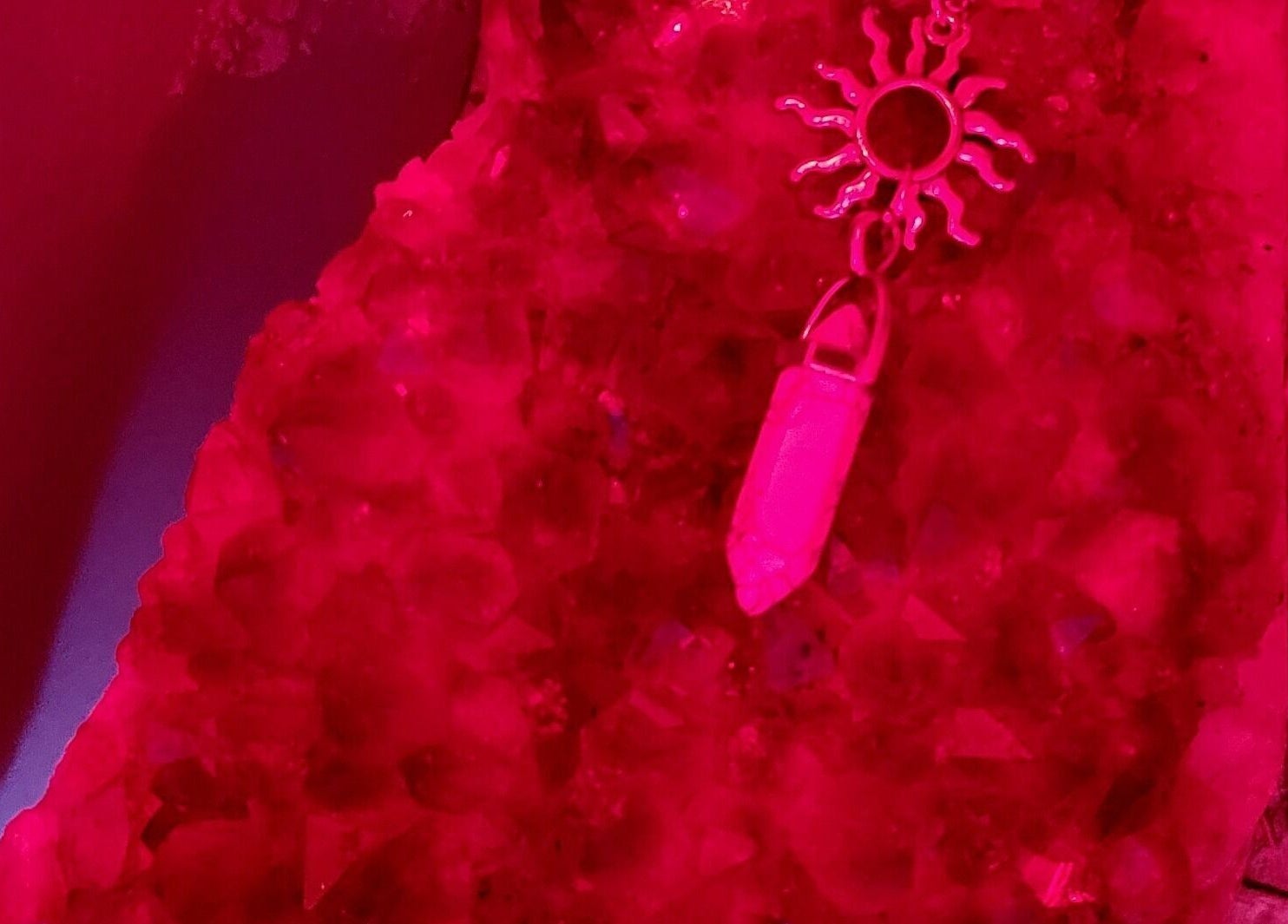 Crimson-toned crystal and pendant at The Compass Spa Therapy & Wellbeing in Tampa, Florida, US.