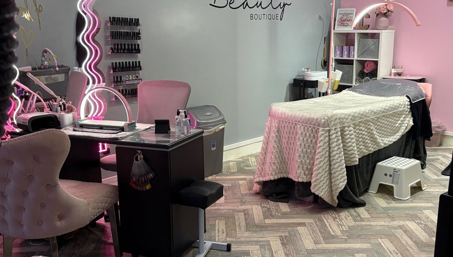Modern interior of Clarissa's Beauty Boutique in March, England, GB featuring a cozy treatment table and chic décor.