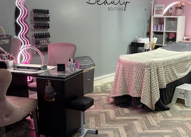 Modern interior of Clarissa's Beauty Boutique in March, England, GB featuring a cozy treatment table and chic décor.