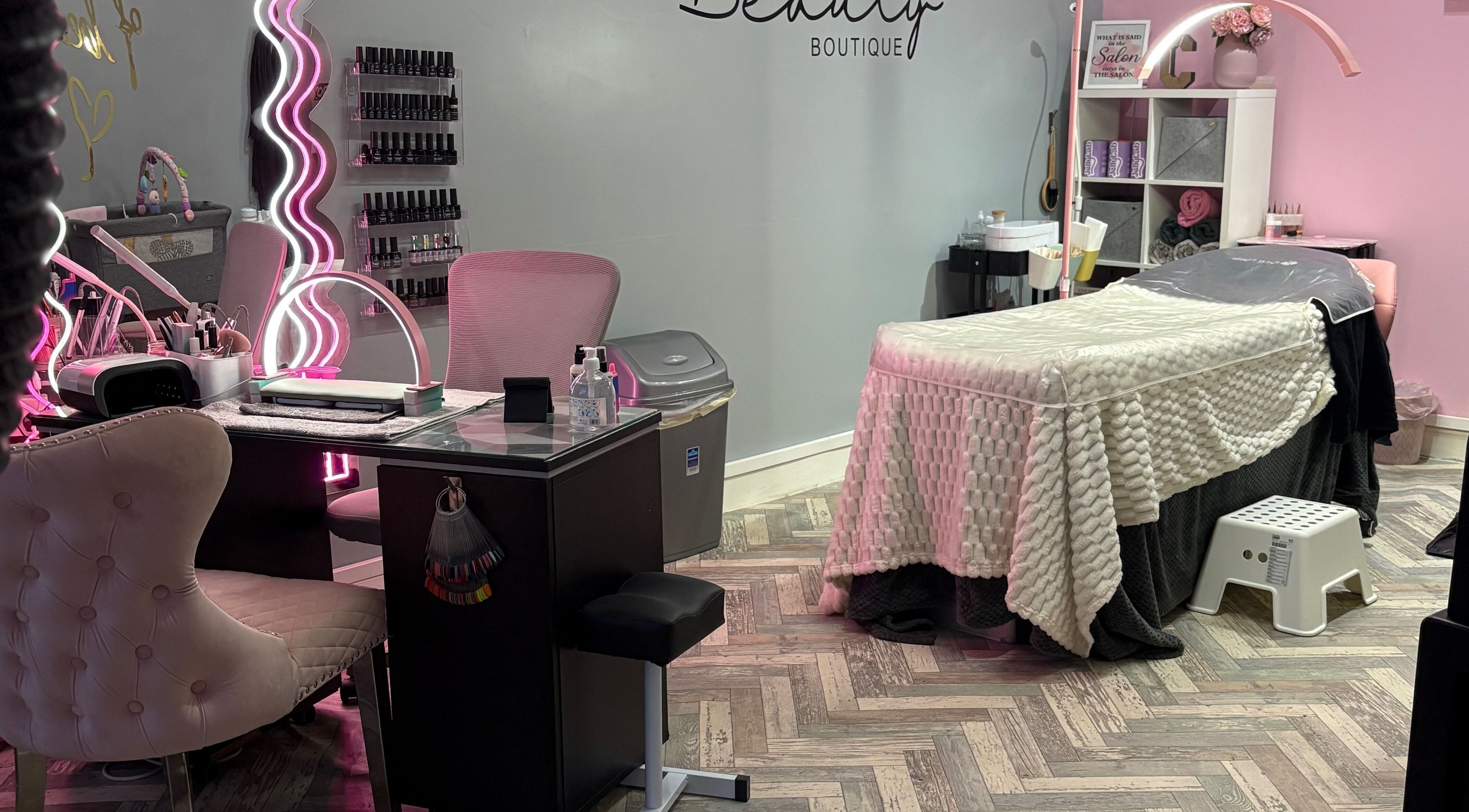 Modern interior of Clarissa's Beauty Boutique in March, England, GB featuring a cozy treatment table and chic décor.