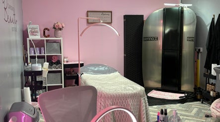 Inside Clarissa's Beauty Boutique in March, England. Modern treatment room with pink decor and cozy ambiance.