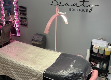 Cozy treatment area at Clarissa's Beauty Boutique, March, England, GB, with chic lighting and elegant decor.