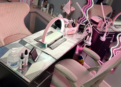 Chic nail station at Clarissa's Beauty Boutique in March, England, GB, featuring elegant pink decor.