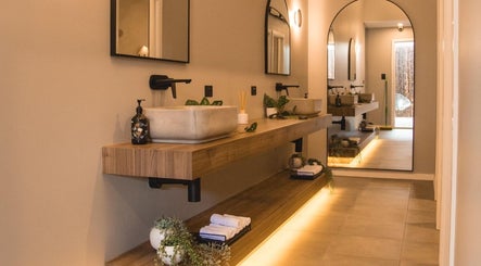 Elegant bathroom at My Recovery Lounge, Port Melbourne Beach, Victoria, AU, showcasing modern design and mirrors.