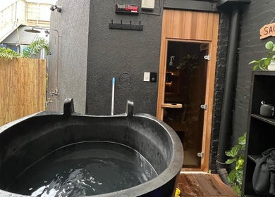 Outdoor sauna and shower area at My Recovery Lounge, Port Melbourne Beach, Victoria, AU, offering relaxation.