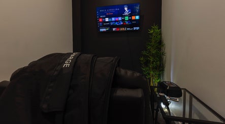 Cozy lounge area at My Recovery Lounge, Port Melbourne Beach, Victoria, AU, featuring a recliner and TV.