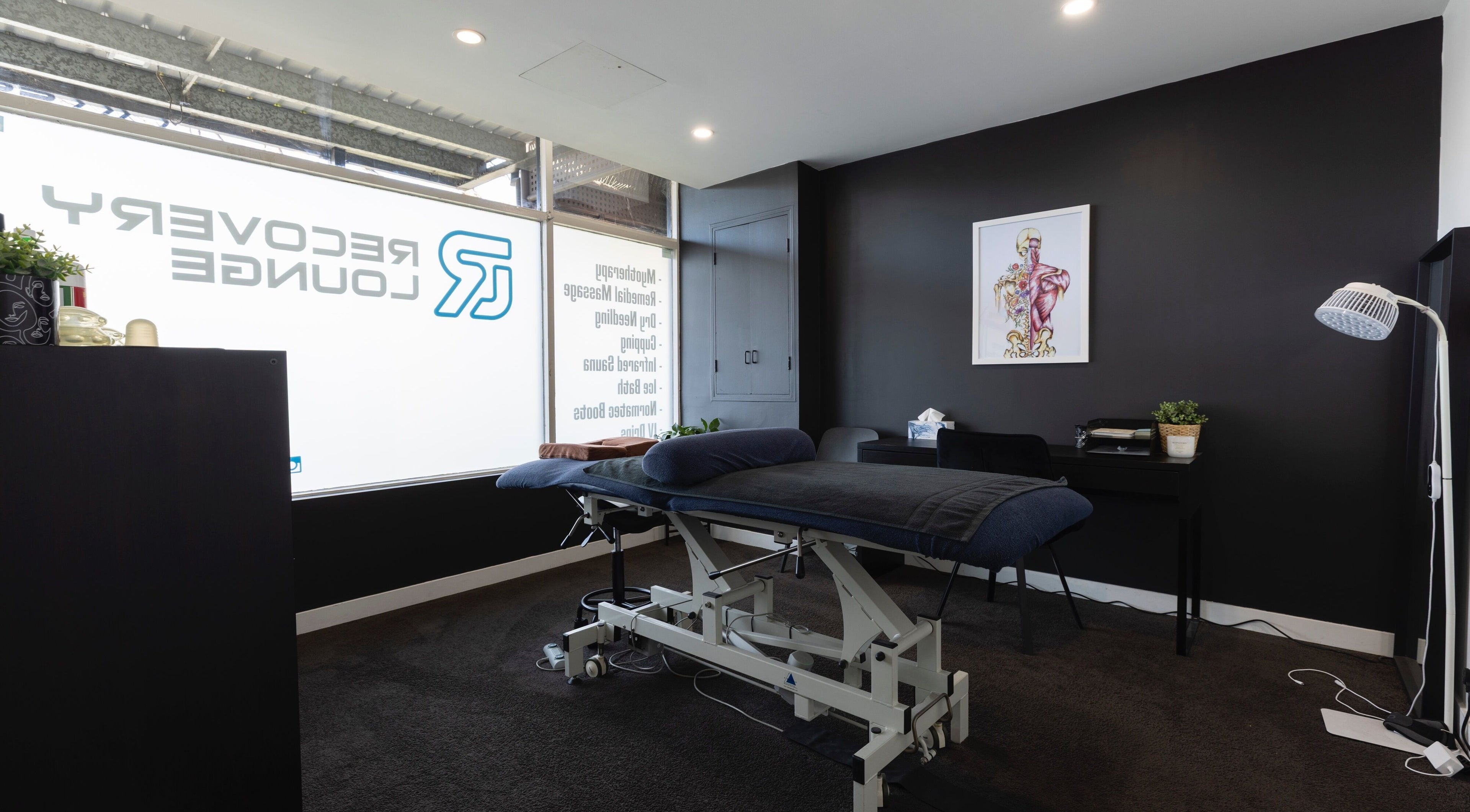 Therapy room at My Recovery Lounge, Port Melbourne Beach, Victoria, AU, featuring a massage table and serene setting.