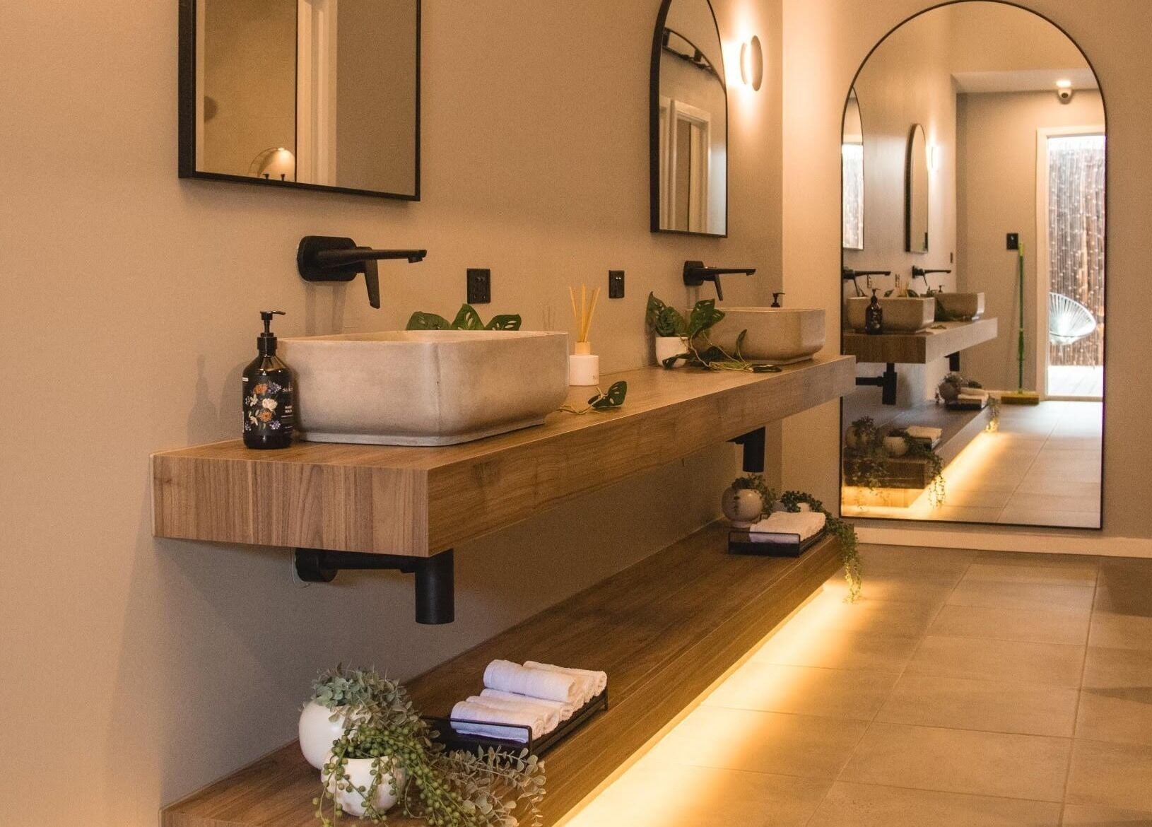Serene bathroom at My Recovery Lounge, Port Melbourne Beach, Victoria, AU with wooden vanity and ambient lighting.