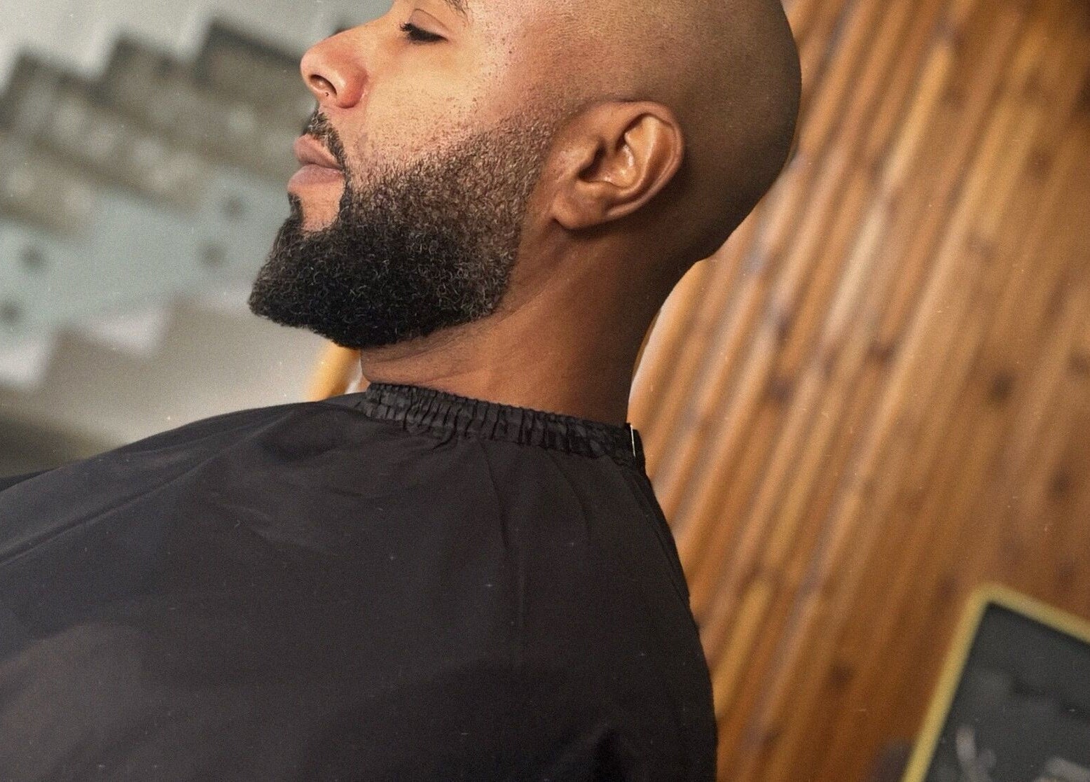 A man receiving a beard trim at Georgekutz Hair Studio in Seeb, Muscat Governorate, OM.