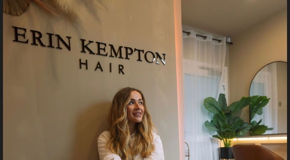 Erin Kempton Hair salon interior in Bathgate, Scotland, featuring a chic decor with a seated guest.
