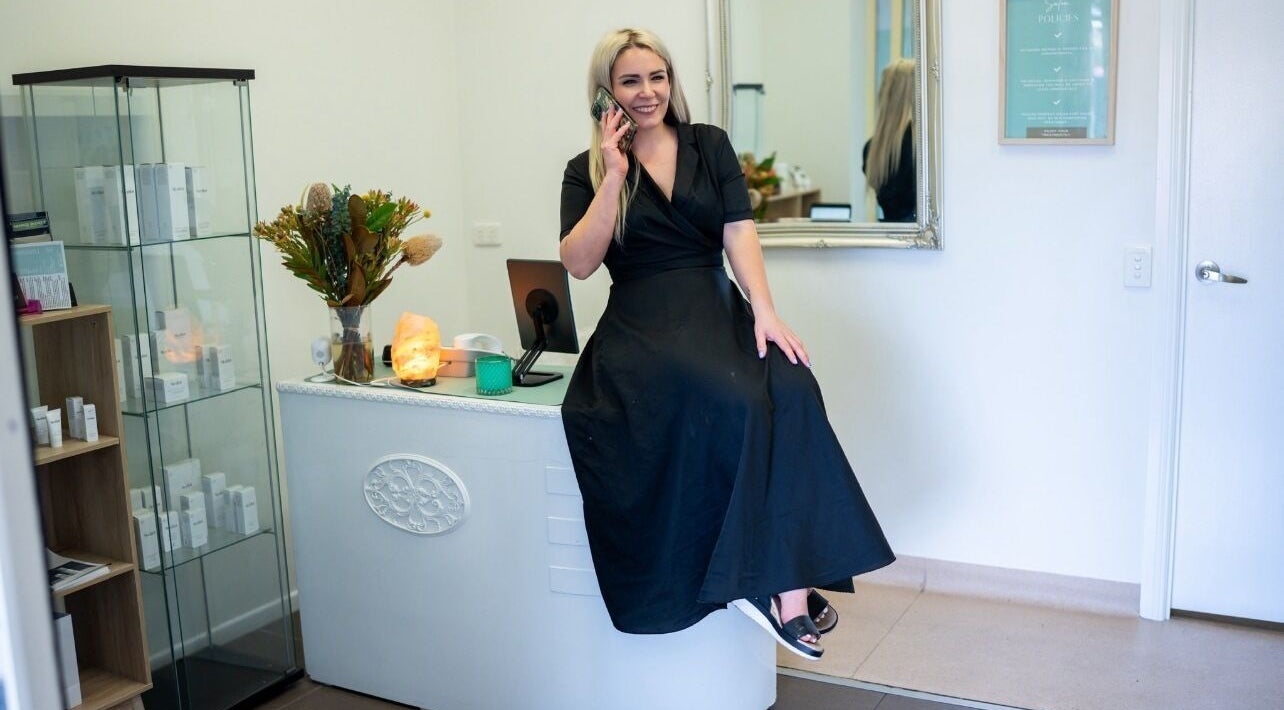 Reception area at Krissi's Beauty Therapy in Regents Park, Queensland, AU, with a welcoming staff member.