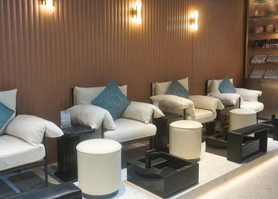 Relaxing seating area at mea Beauty Lounge - Jumeirah Golf Estates, Dubai, Dubai, AE, with elegant decor.