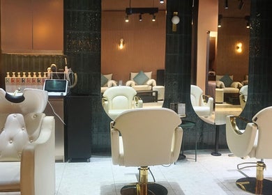 Chic interior of mea Beauty Lounge - Jumeirah Golf Estates, Dubai, Dubai, AE, featuring stylish salon chairs.