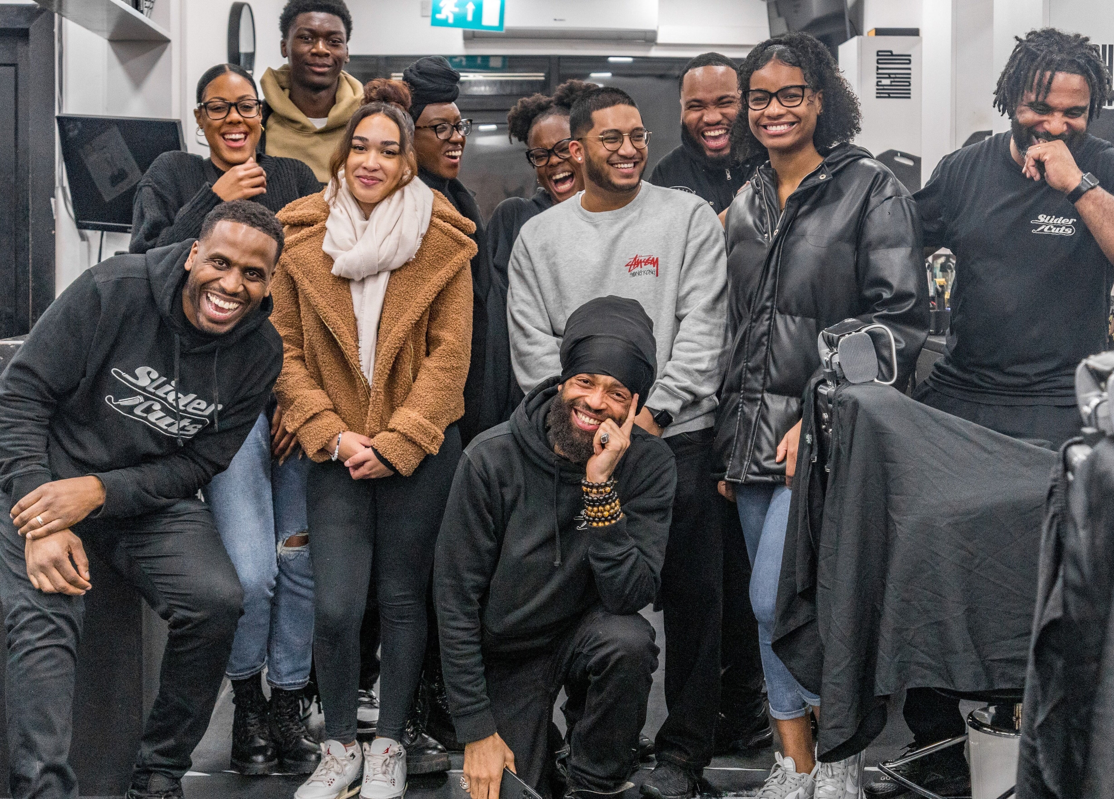 Happy team at SliderCuts, a vibrant beauty venue in London, England, GB.