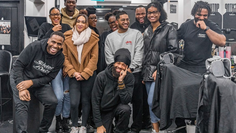 Group of people smiling in SliderCuts - Black Eats Fest, London, England, GB, capturing joyful moments.