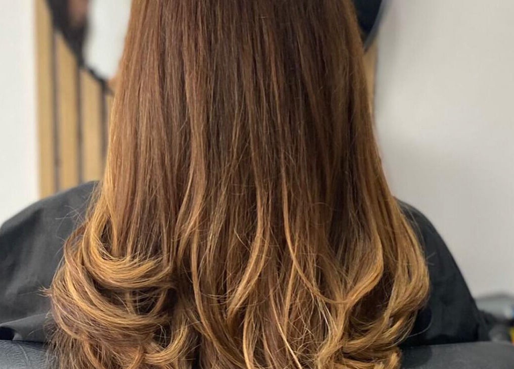 Elegant hairstyle with soft curls at Blended, Canvey Island, England, GB.