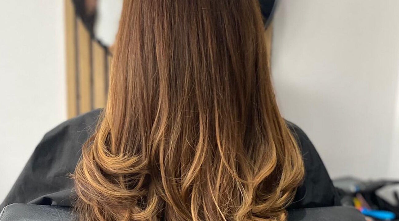 Elegant hairstyle with soft curls at Blended, Canvey Island, England, GB.